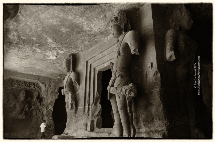 Dvarapalas (guard figures) at Elephanta with Siva (Andhakasura Vadh) in the back lett.
